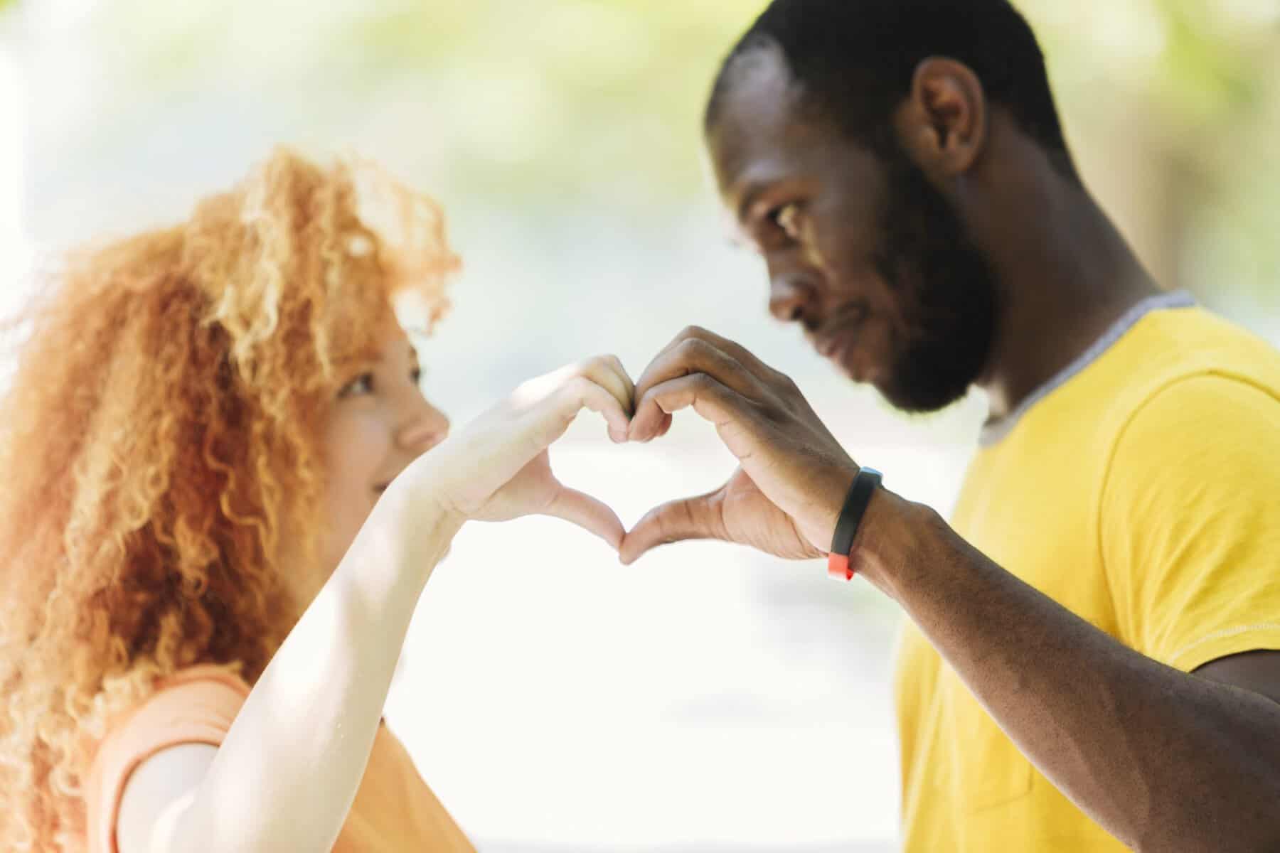 close up couple making heart