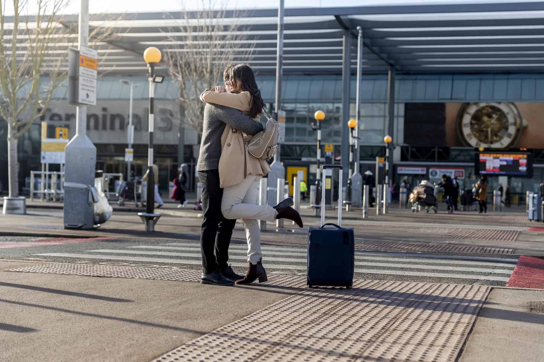 couple hugging after not seeing each other for a long time